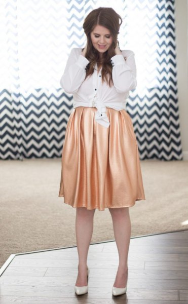 white knotted shirt with buttons and pink silk pleated skirt