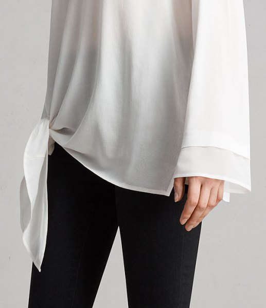 white knotted long-sleeved chiffon tunic T-shirt with wide sleeves and black skinny jeans