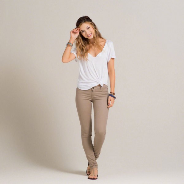 white knotted t-shirt with crepe skinny khaki jeans