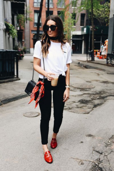 white knotted t-shirt with black skinny jeans and red leather loafers