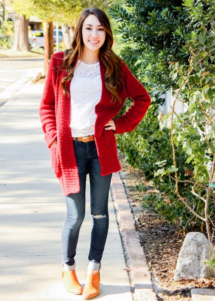 white lace blouse with a red, chunky cardigan