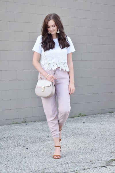 white lace top with gray high pants with straight legs