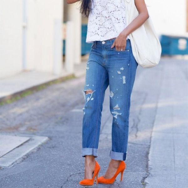 white lace short-sleeved top with blue tied boyfriend jeans
