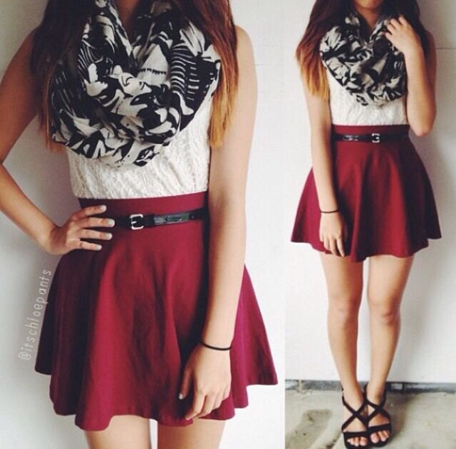 sleeveless blouse made of white lace with a burgundy skater skirt with belt