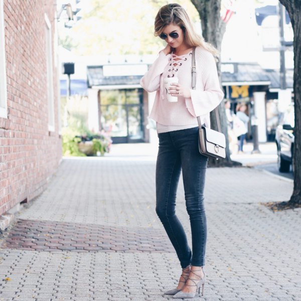 white, cropped sweater with neckline and gray skinny jeans