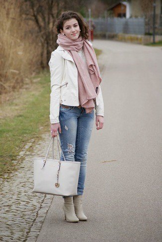 white leather blazer with blue jeans with cuffs and pink boots with heels