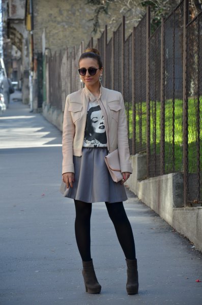 white leather jacket with gray minirater skirt
