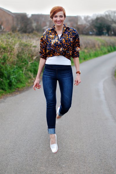 white moccasins, black floral knotted shirt