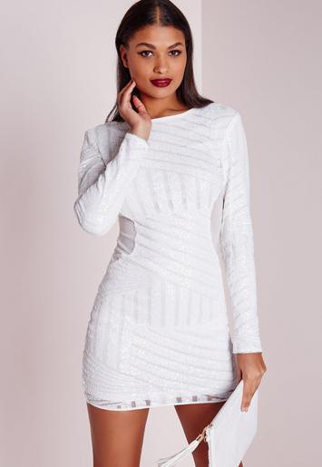 white, long-sleeved, figure-hugging mini dress with a subtle pattern