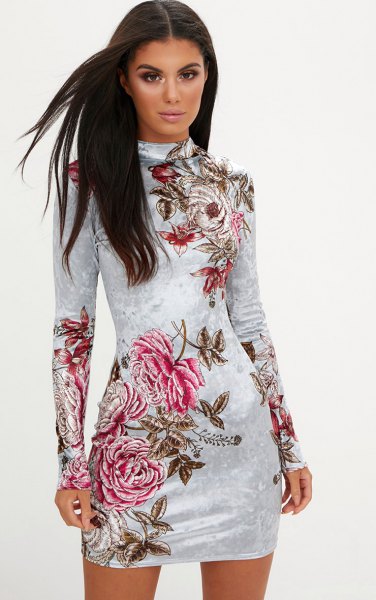 white, long-sleeved, figure-hugging dress made of floral velvet