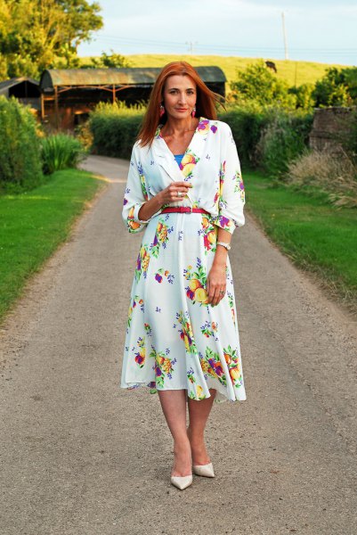 white long-sleeved midi dress with floral pattern and belt