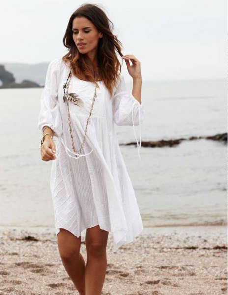 white long-sleeved mini dress made of cotton with scoop neckline
