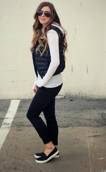 white long-sleeved T-shirt with short black puffer vest with hood