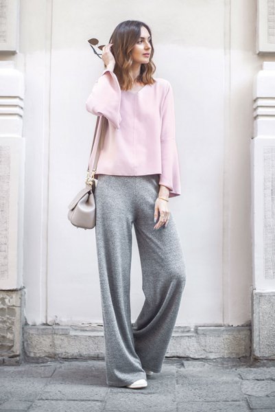 white long-sleeved top with gray pants with wide legs