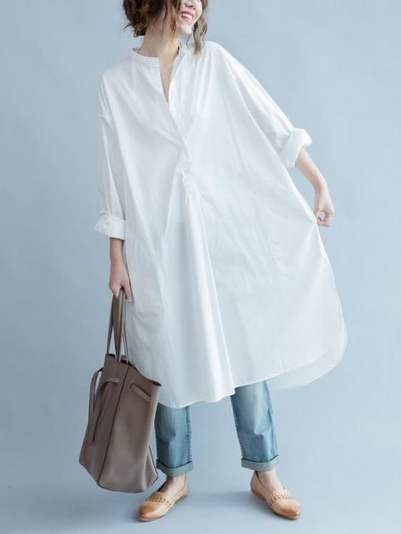 white long-sleeved tunic shirt with blue jeans and slippers