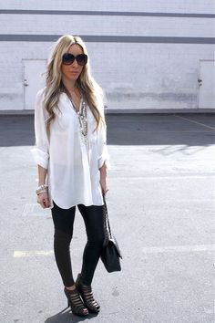 white longline shirt with buttons, black leggings and cut-out boots