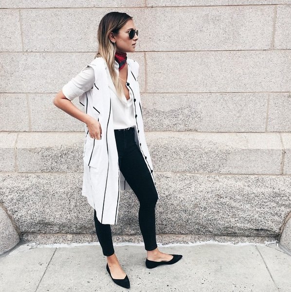 white longline vest with a long blouse and black pointed flats