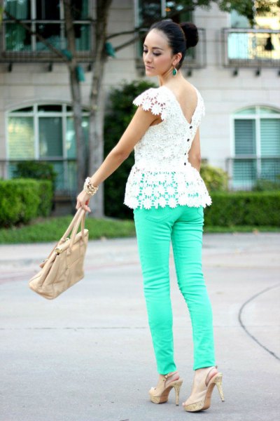 white peplum top made of lace with pink back and pink skinny jeans
