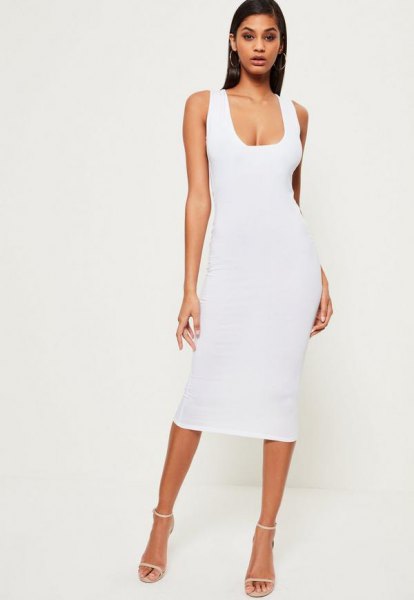 white, figure-hugging midi dress with a low square neck