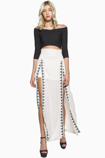 white maxi skirt with black three-quarter sleeves over the shoulder