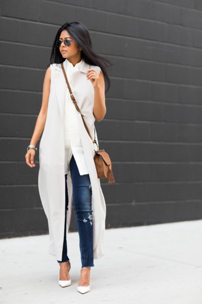white sleeveless maxi dress with blue skinny jeans