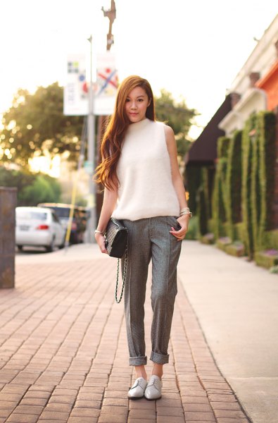 white sleeveless knitted sweater tweed pants with mock neck