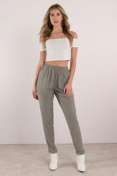 white strapless crop top with green khaki pants with elastic waist