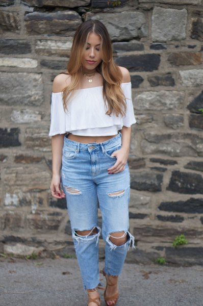 white strapless cropped blouse with ripped knee mom jeans
