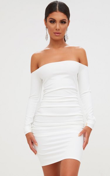 white, figure-hugging dress gathered from the shoulder