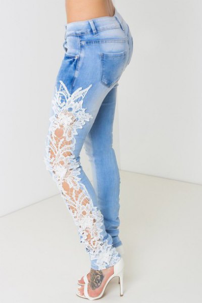 white open heels with light blue skyscraper jeans