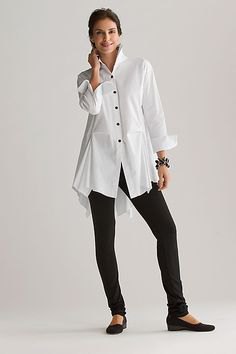 white oversized shirt with buttons and black leggings