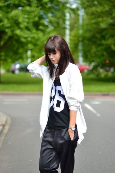 white oversized jacket with black printed t-shirt and wide pants