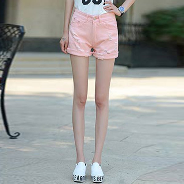 white printed t-shirt with light pink shorts and sneakers with cuffs