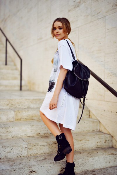 white printed t-shirt dress with ankle boots with velvet backpack purse