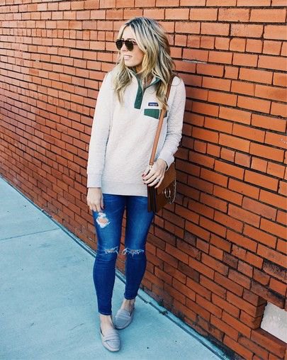 white quarter zip oversized sweater blue ripped jeans