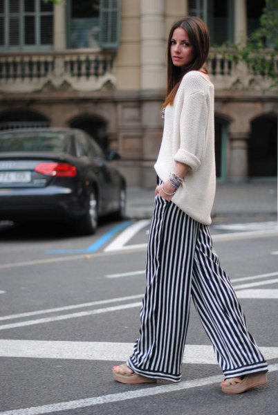white knitted sweater with relaxed fit and striped pants