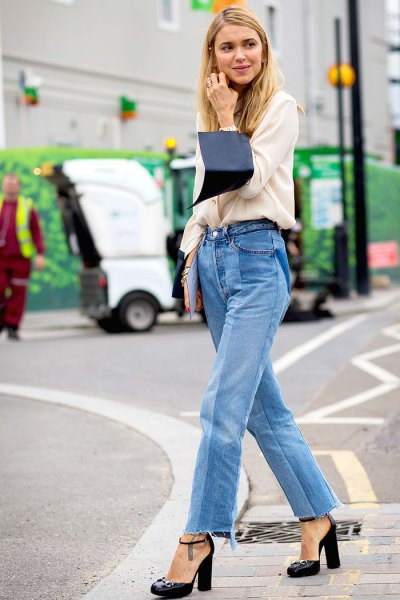 white sweater with relaxed fit and blue mom jeans