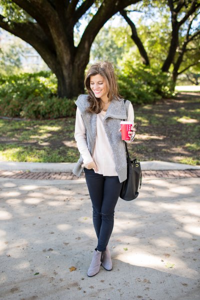 white, loose-fitting, thin sweater with gray faux fur vest