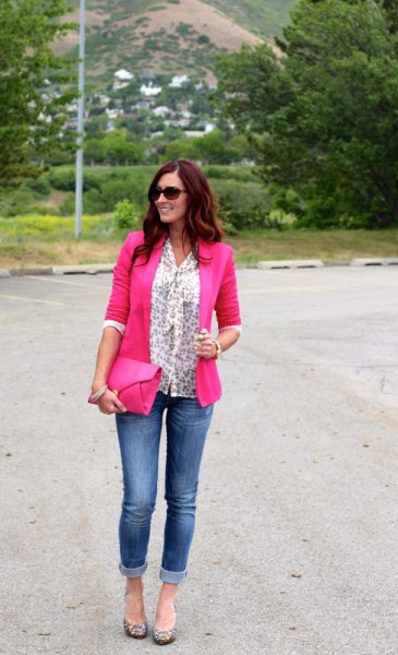 Blouse with a white bow pattern and neon pink blazer and jeans