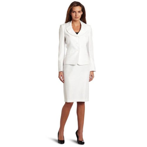 white blazer with a round collar, skirt and black, rounded leather heels
