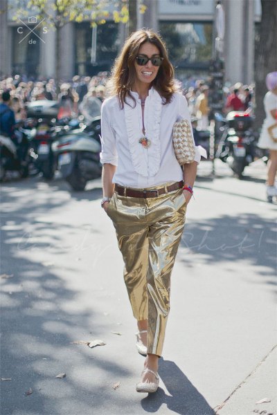 white blouse with frill neckline and gold metallic trousers