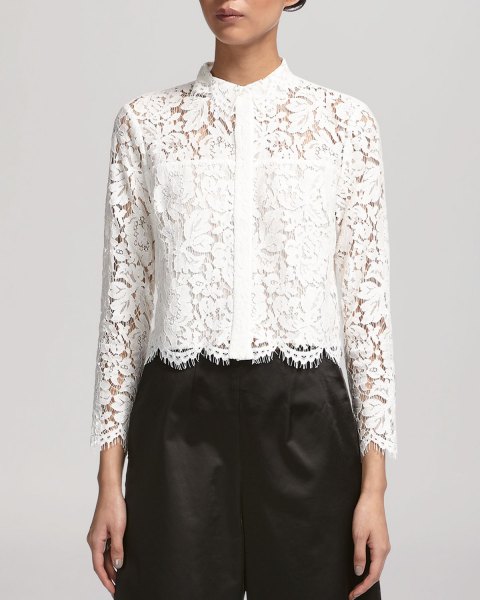 white lace shirt with scalloped hem, black trousers