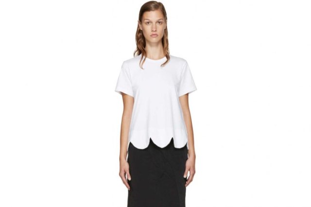 white t-shirt with scalloped hem and black midi denim skirt