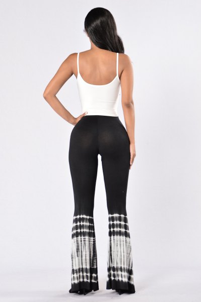 white tank top with scoop neckline and black yoga pants