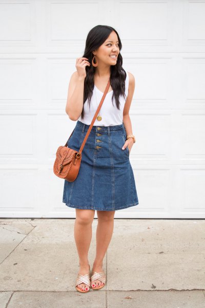 white tank top with scoop neckline and flared knee-length skirt made of blue denim
