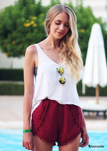 white tank top with scoop neckline and red mini-shorts