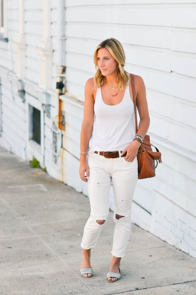 white tank top with scoop neckline and ripped jeans