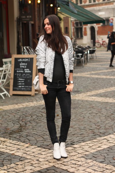 shiny white bomber jacket with a completely black outfit