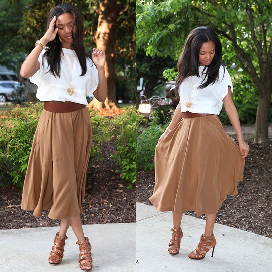 white short-sleeved blouse with a green midi skirt