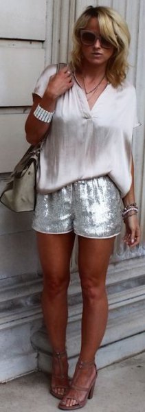 white short-sleeved blouse with silver sequin shorts
